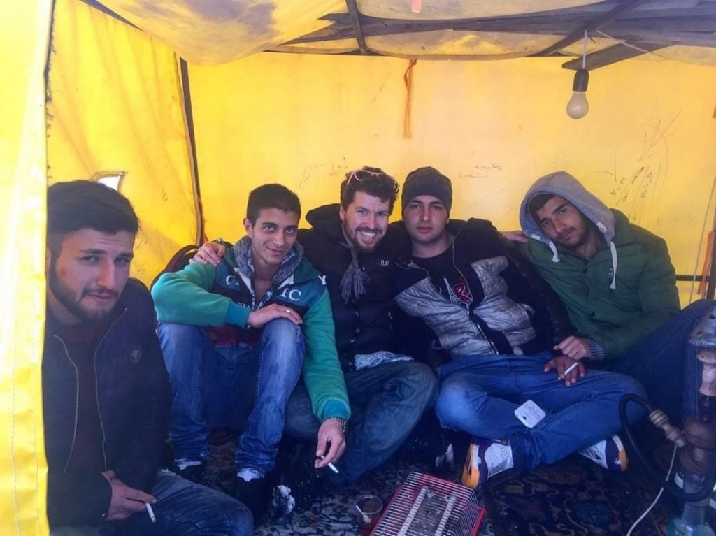 Will in a tent with four local men whilst hitchhiking and camping