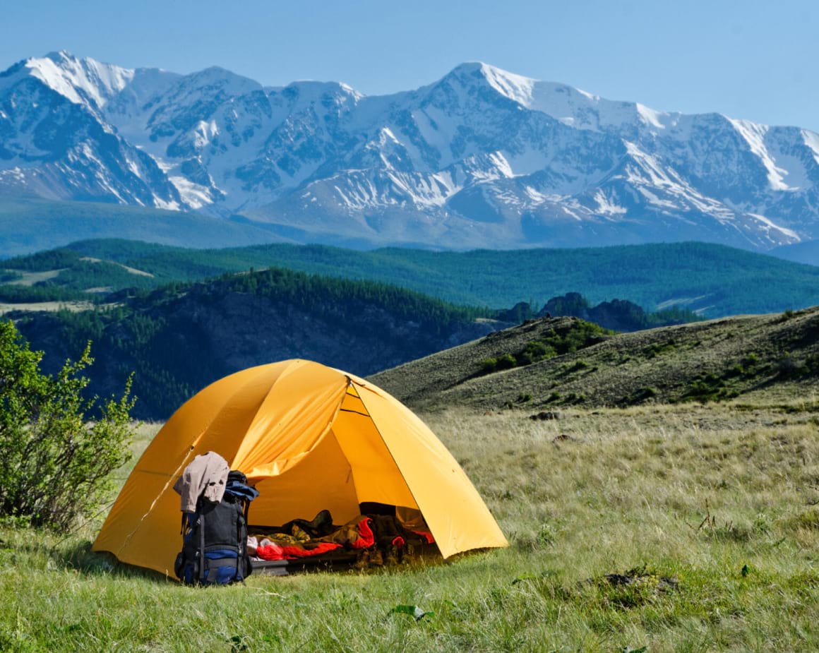 tourist tent camping in mountains