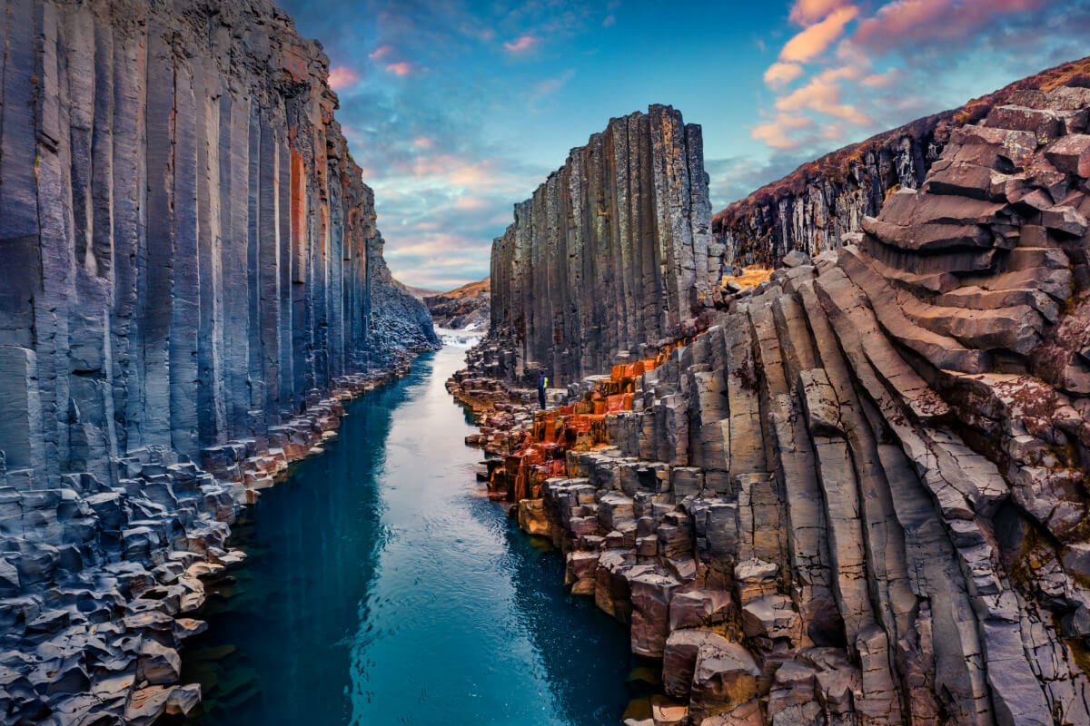 Icelandic sunset over awesome geological formations and river
