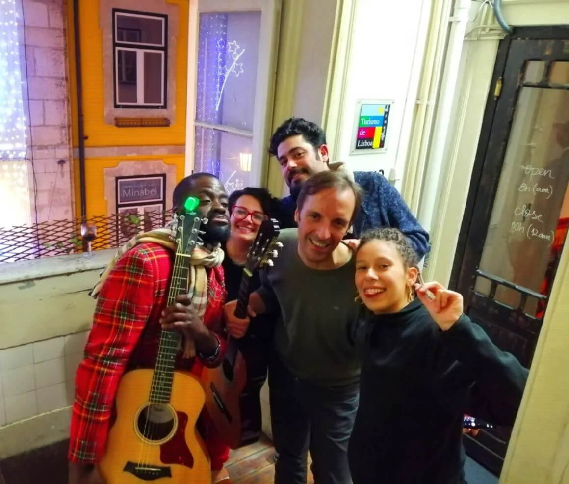 Rossio Hostel (Best Hostels in Lisbon) friends posing with guitars playing live music