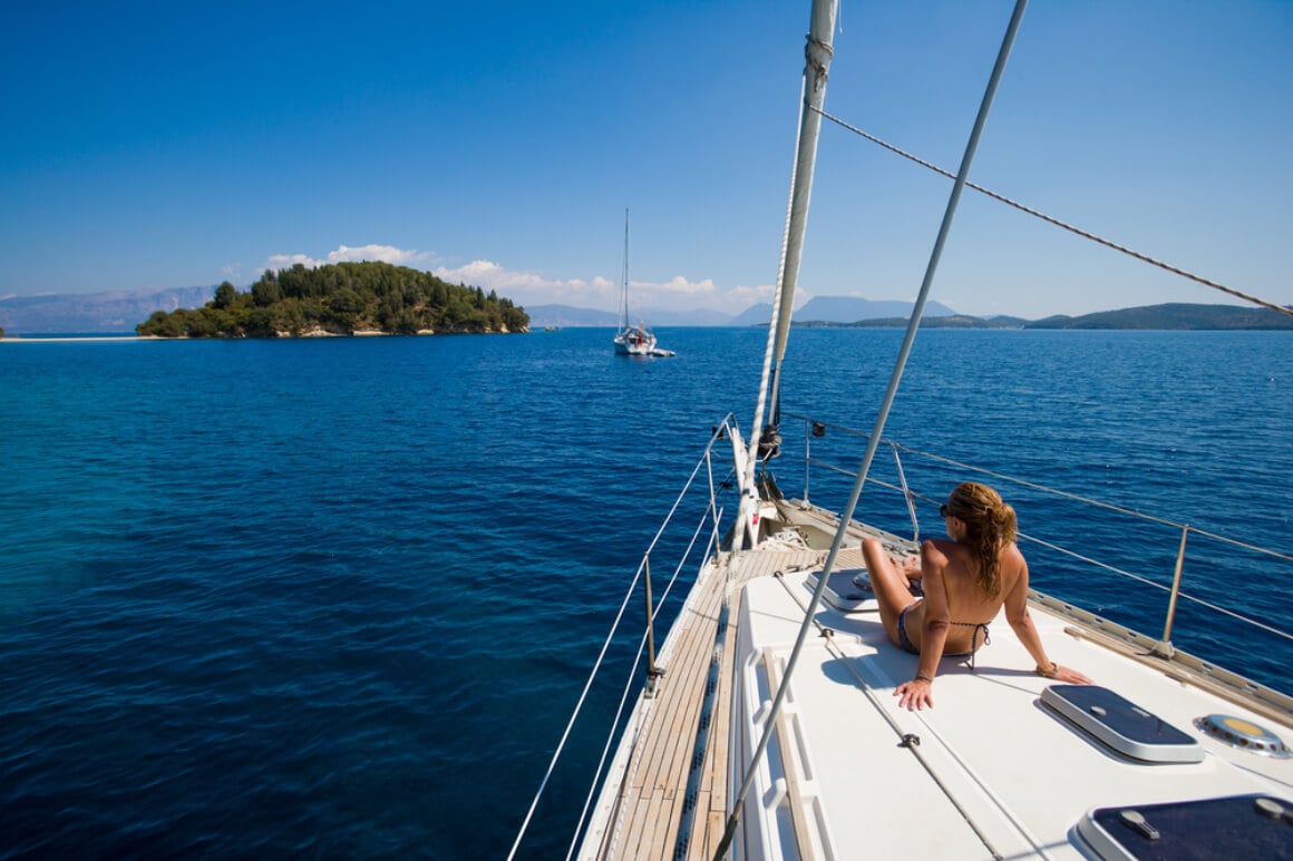 Young woman sailing on yacht Greece