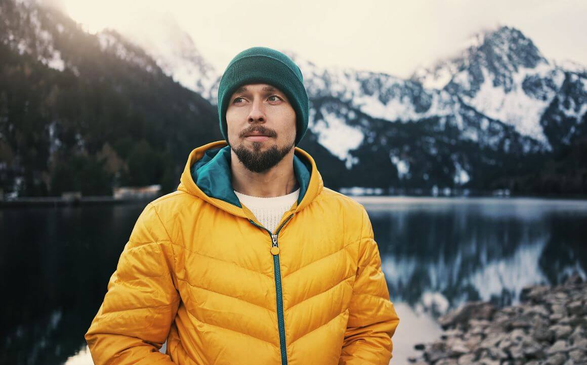 bearded man wearing yellow puff jacket