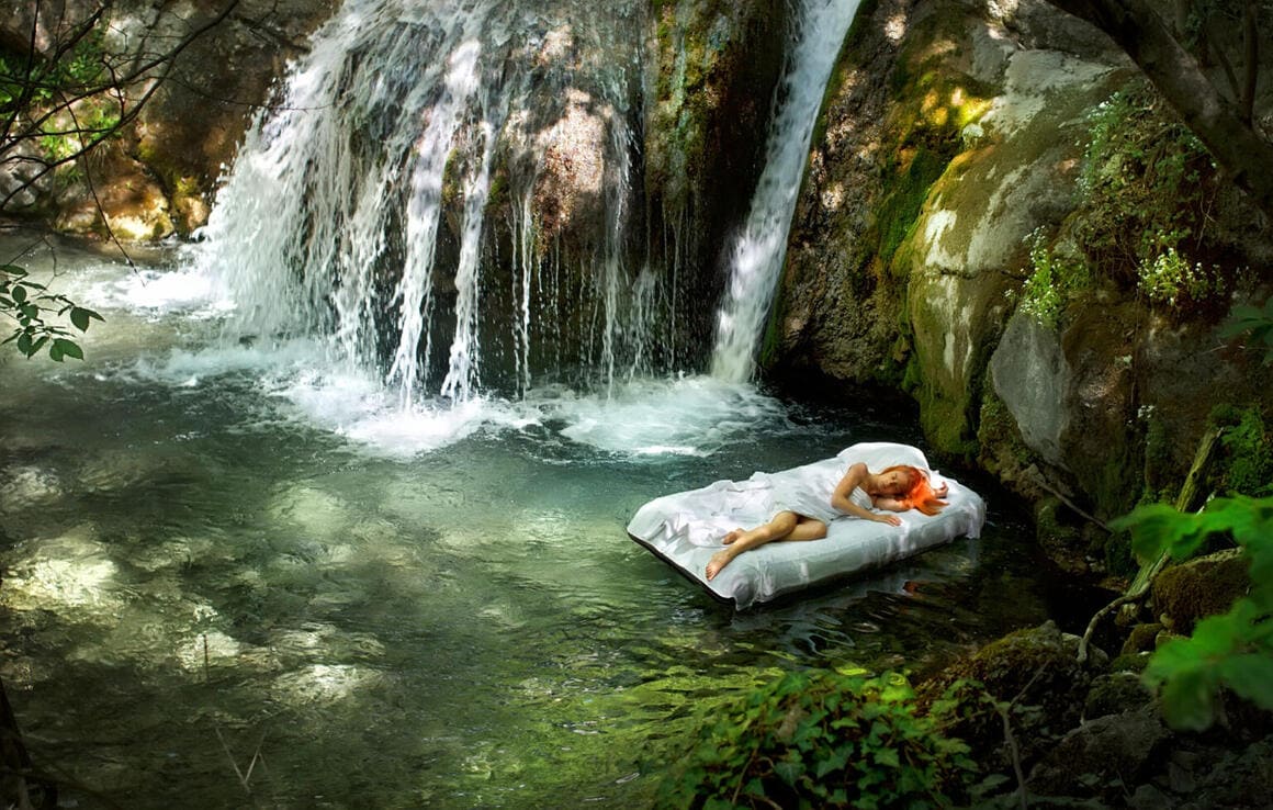 sleeping woman deep forest waterfall