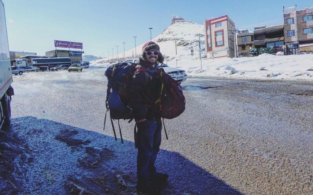 man hitchhiking in Iran