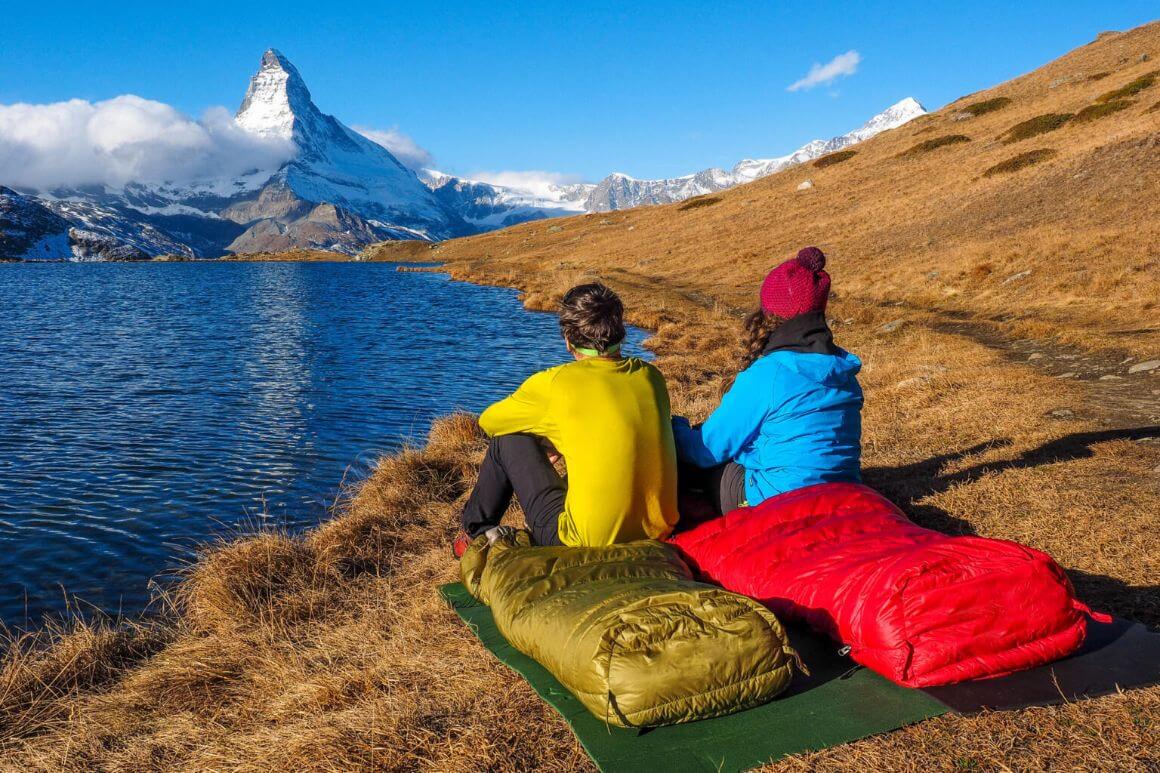 campers admiring mountain and lake