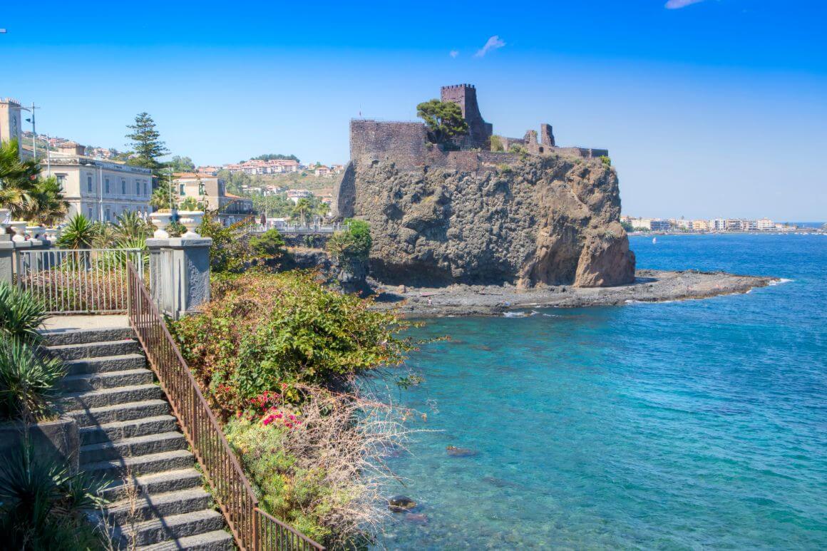 Cityscape of Aci Castello, Catania with historical Castello Normanno castle landmark