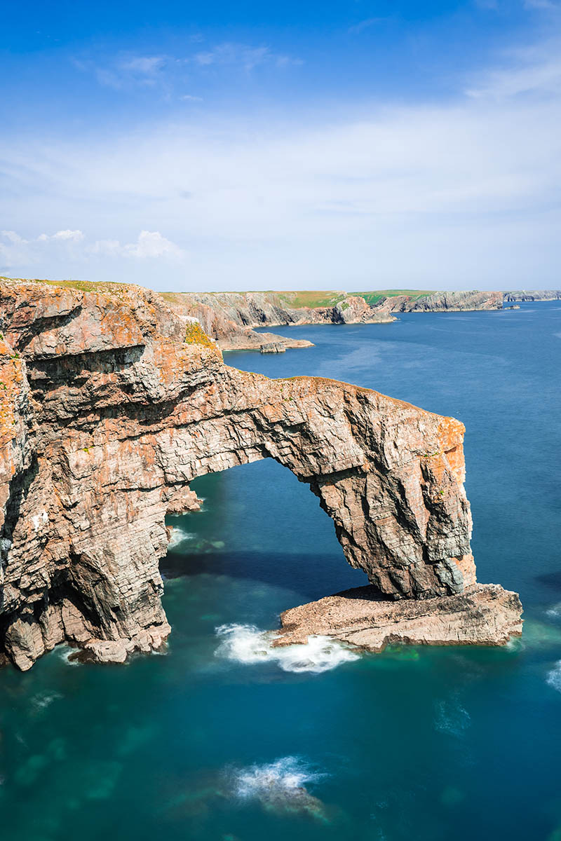 The green bridge of Wales off the coast of Pembroke. Sea stack. tbbteam, Wales, United Kingdom