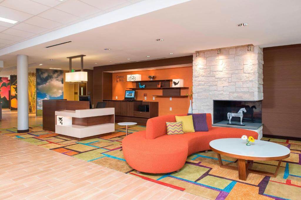 Fairfield Inn & Suites by Marriott's communal space with colorful furniture Fredericksburg