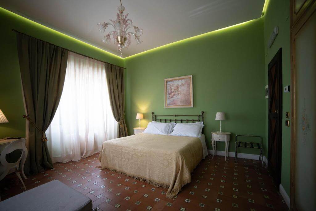 A queen room in the Hotel Villa Dorata Catania