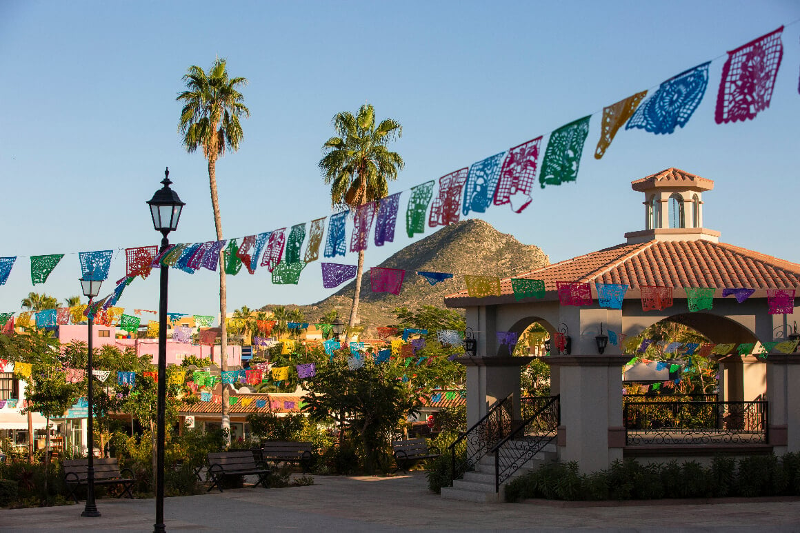 A gasebo surrounded by colorful paper decorations in the heart of downtown Cabo San Lucas 