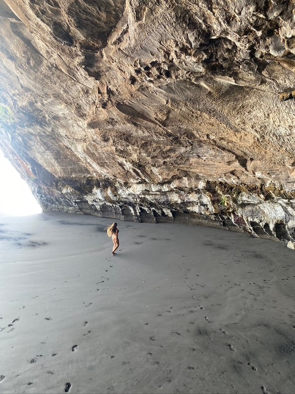 Girl frolicking in a cave in El Salvador whilst hitchhiking.