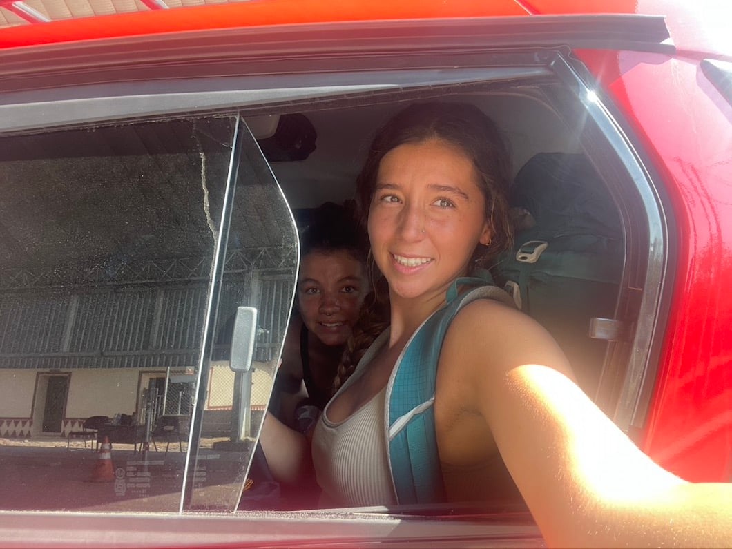 Two girls taking a selfie while hitchhiking in El Salvador.