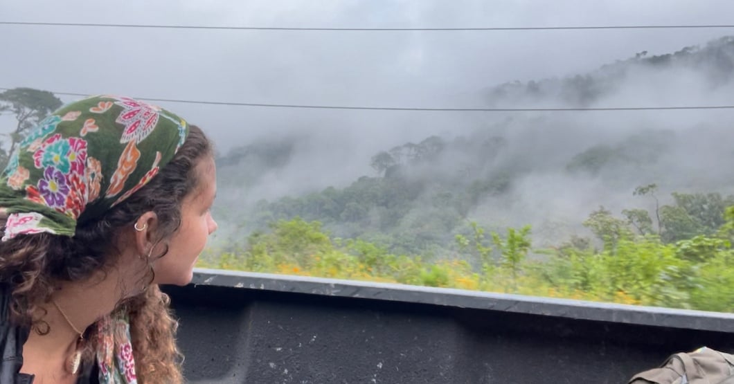 Girl in back of pickup truck while hitchhiking in Mexico.