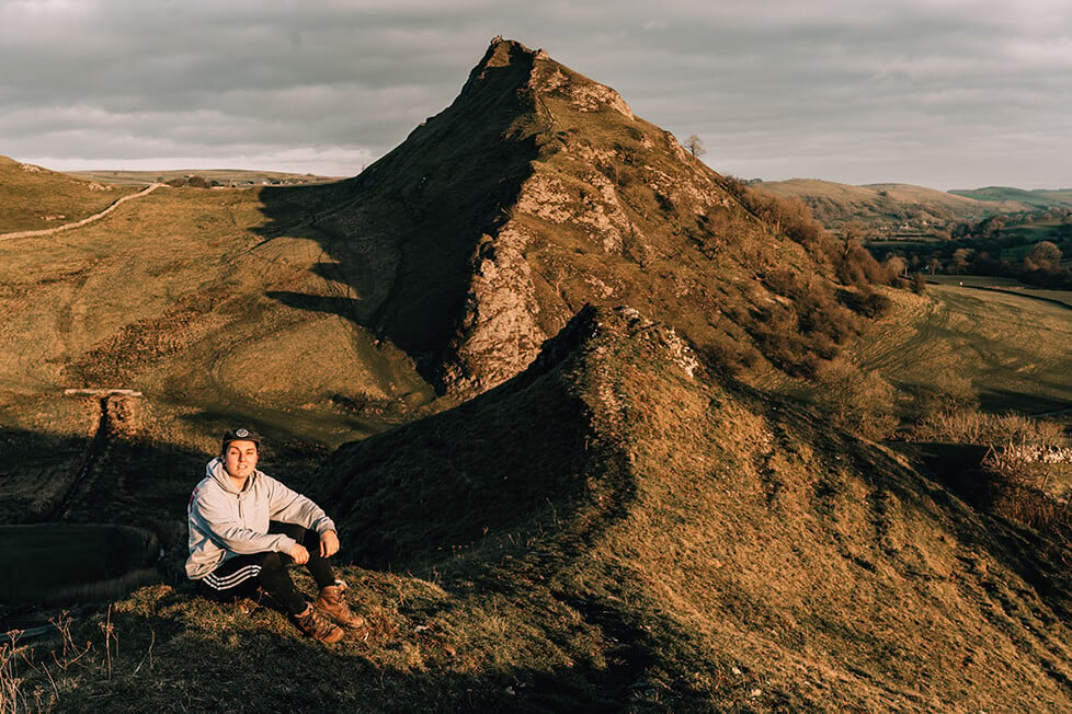 A person sat on Chrome Hill in The Peak District, England