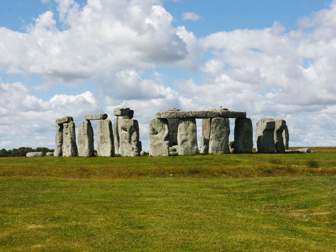 Wiltshire Stonehenge on a sunny day with fluffy clouds in the sky