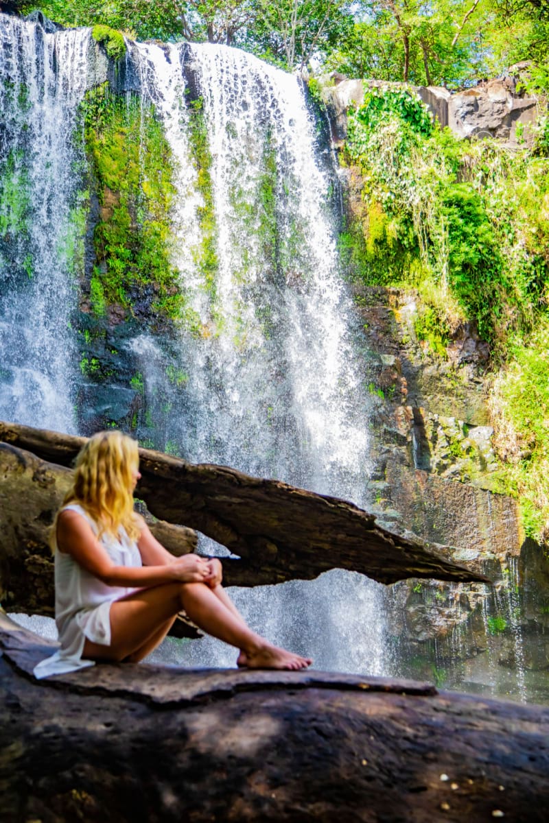 Woman on a background of a waterfall llanos de cortez