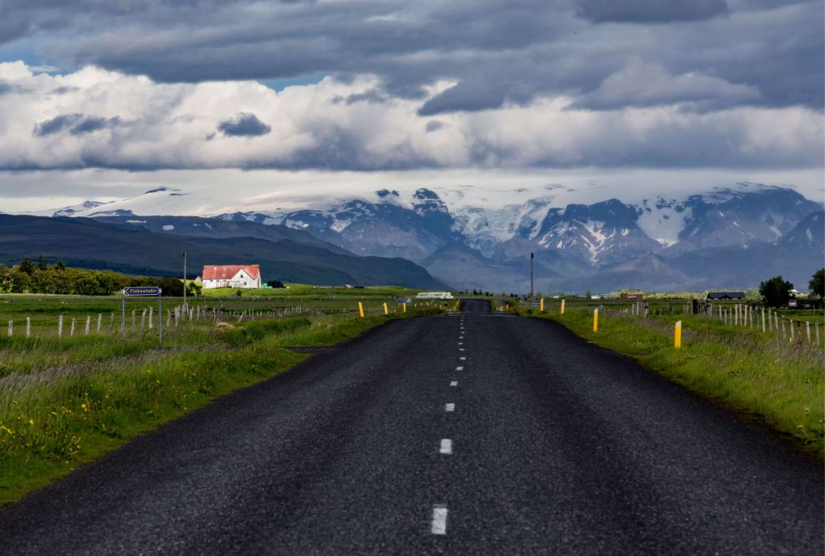 Road around Hvolsvollur area with snowy mountains