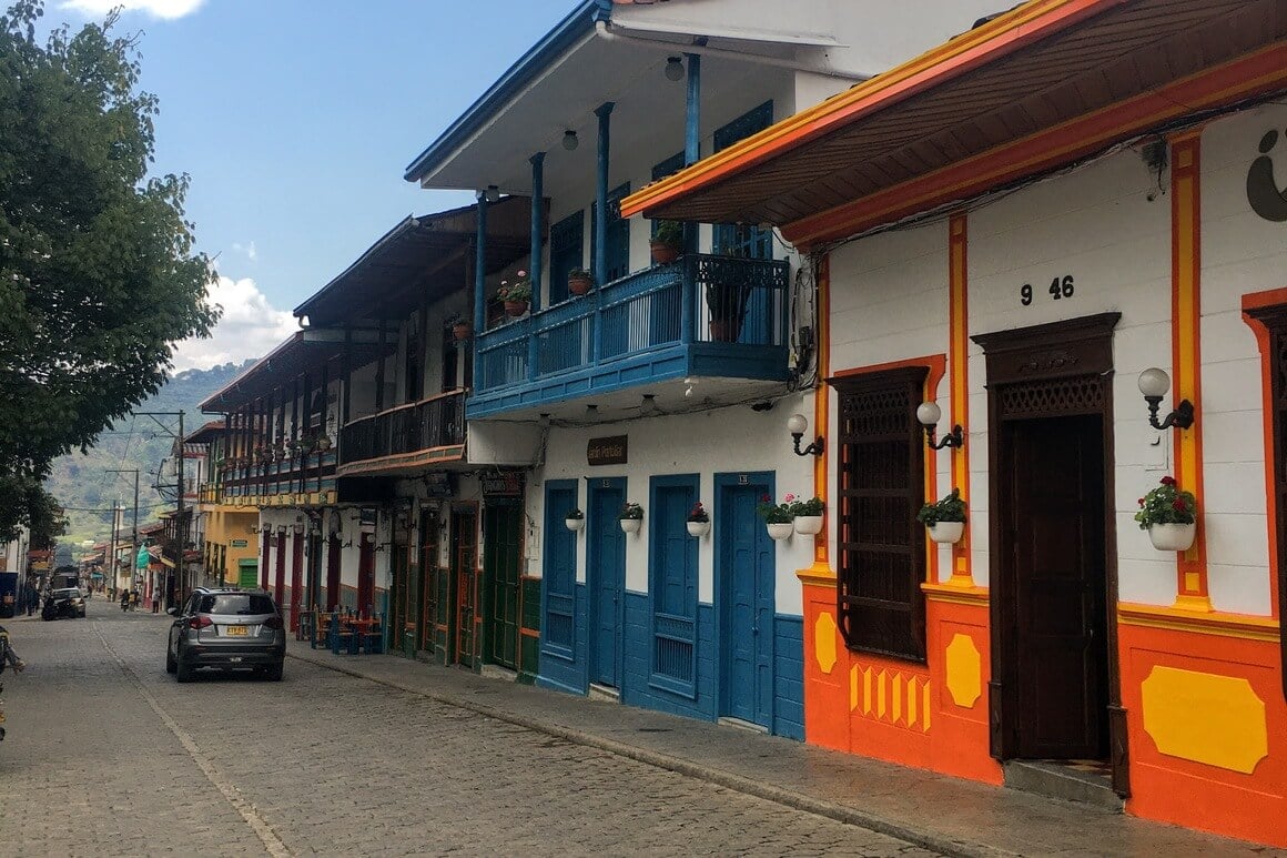 Street with colorful colonial houses in Quito