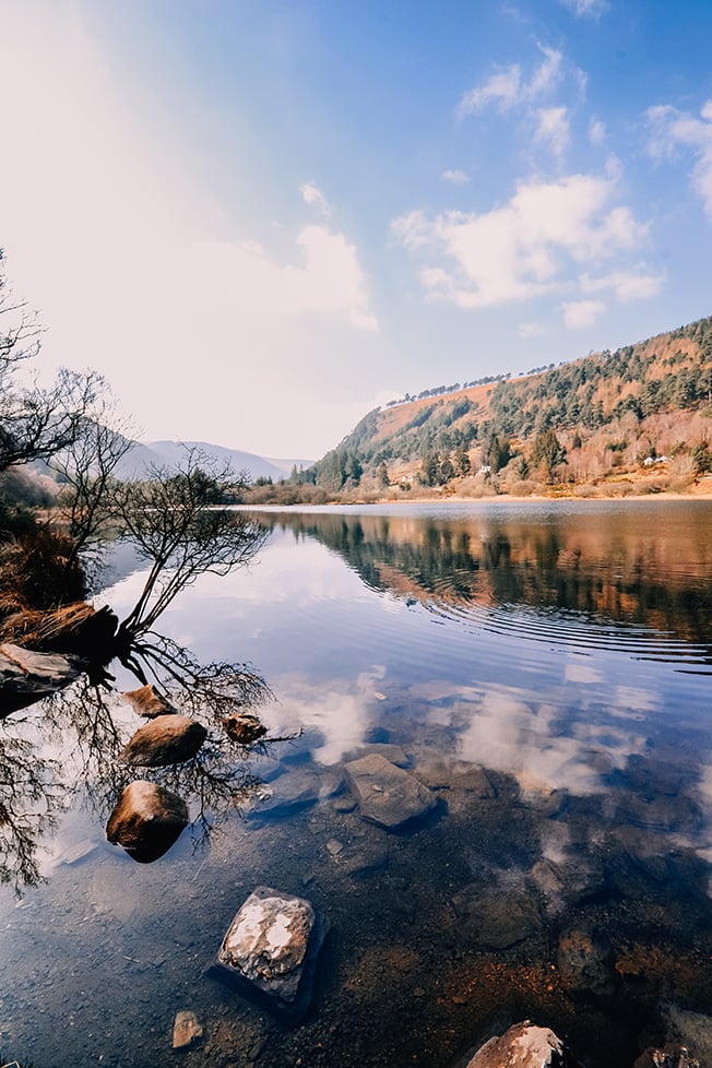 the sky reflecting in a lake in the mountains of Ireland