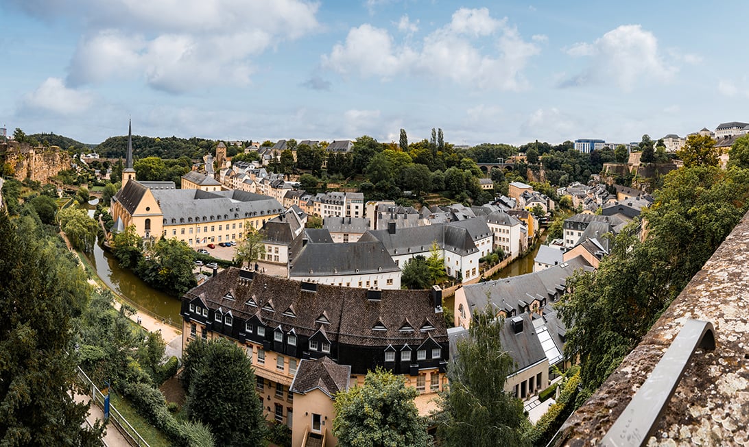 A panoramic view over Luxembourg with a river and cathedral below