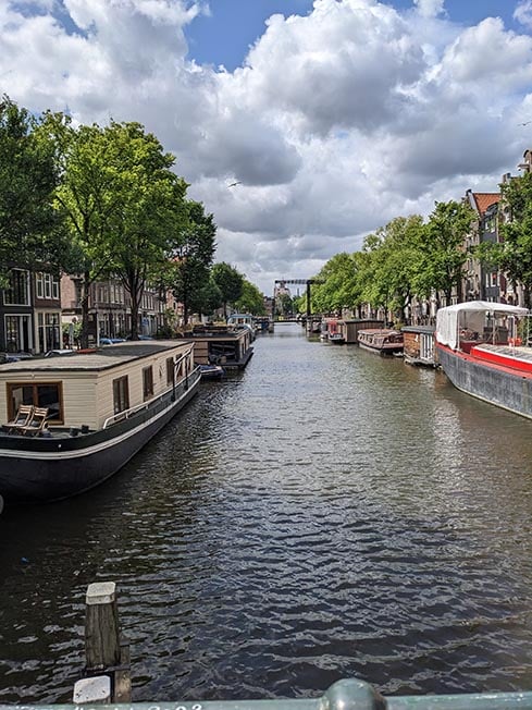 Looking down the canal on a sunny day in Amsterdam