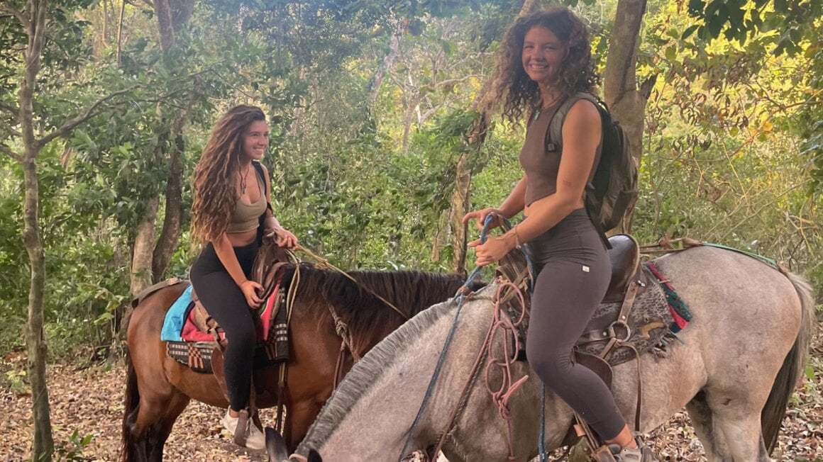 two girls on horses 