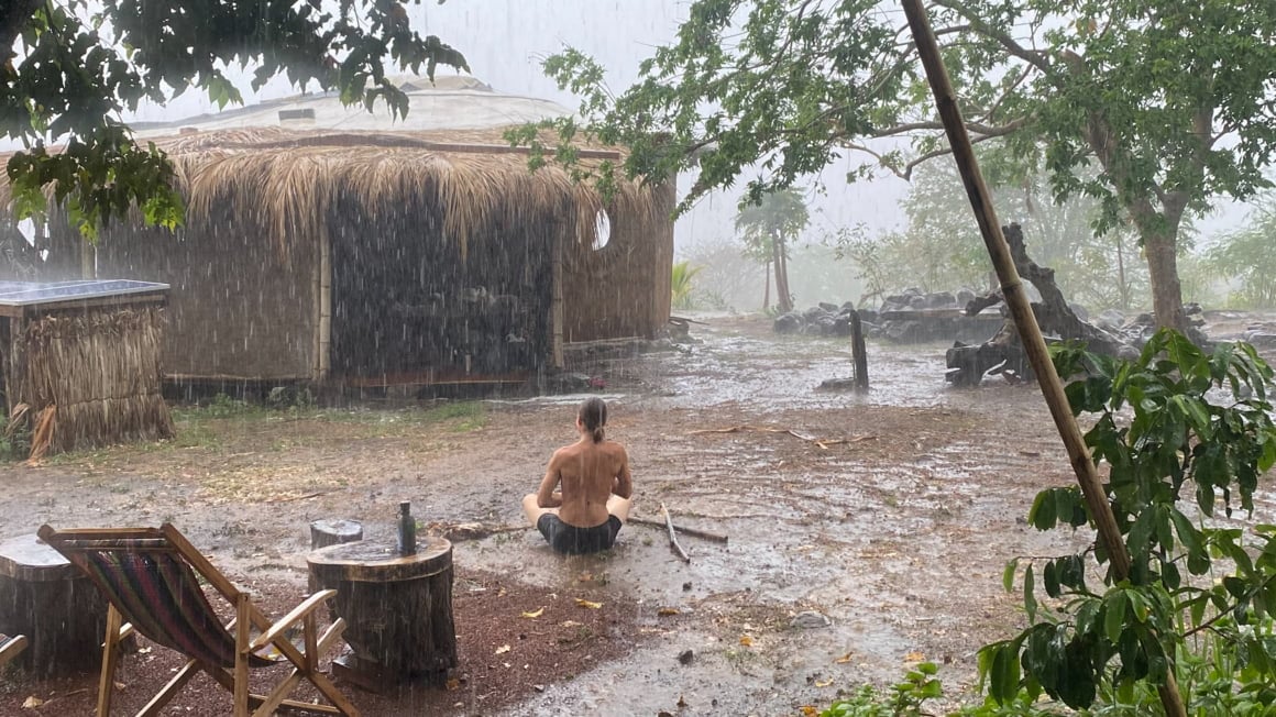 guy meditating in the rain 