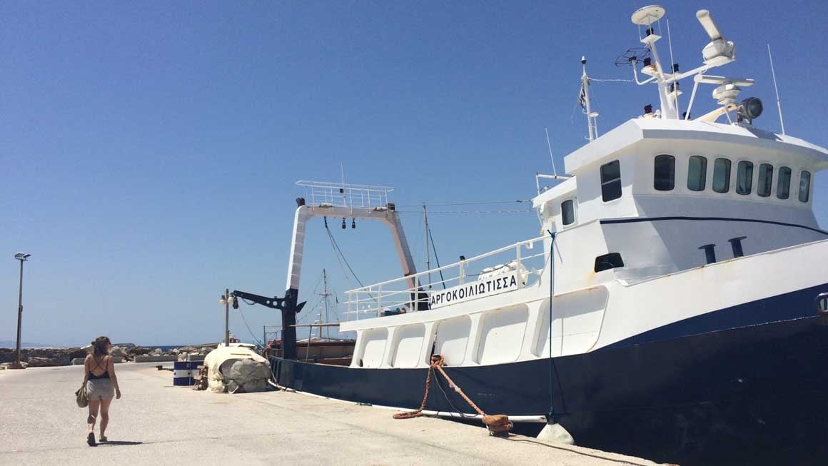 Girl preparing to island hop around the Cyclades islands.