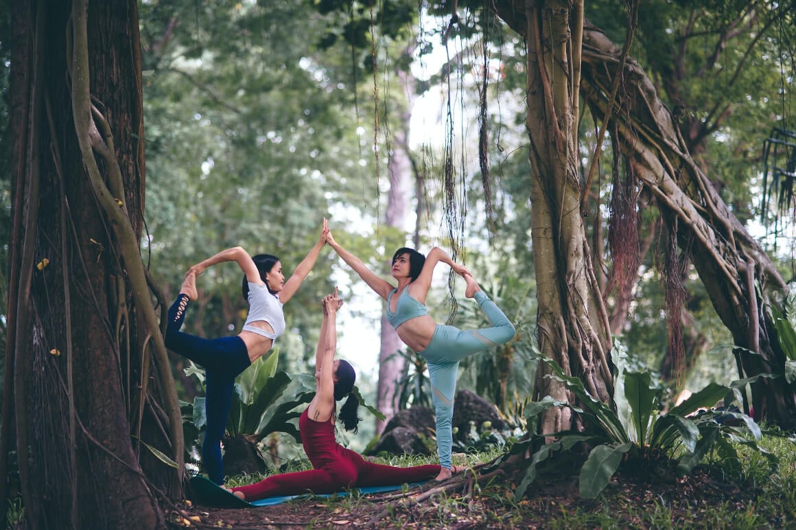 3 women doing yoga in vietnam