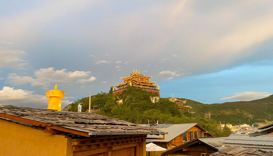 A landscape view of Dafo temple in Yunnan, featuring the world's largest prayer wheel.