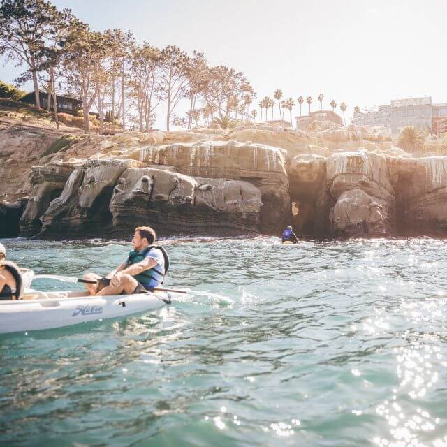 two persons kayaking in La Jolla Sea Cave, San Diego