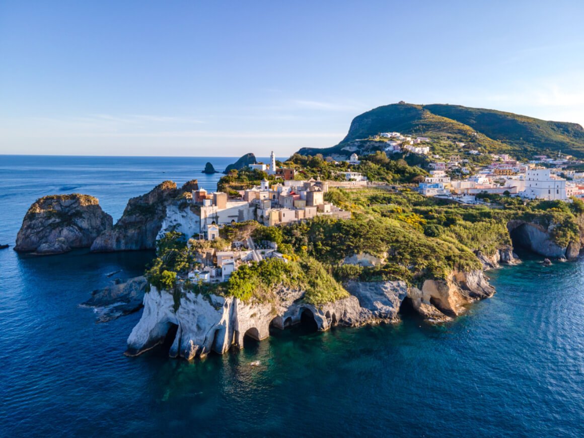 A town with white buildings on a rocky island, surrounded by the Mediterranean in Ponza Italy