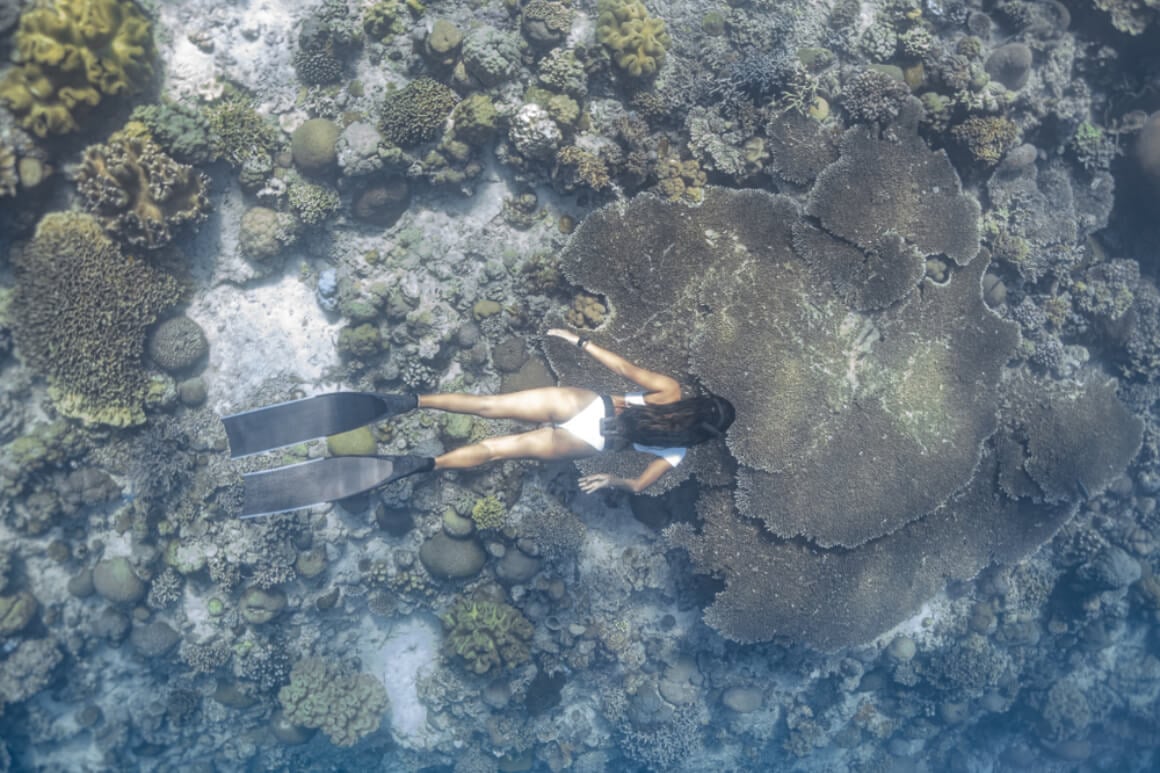 Woman swimming Panagsama Beach Moalboal