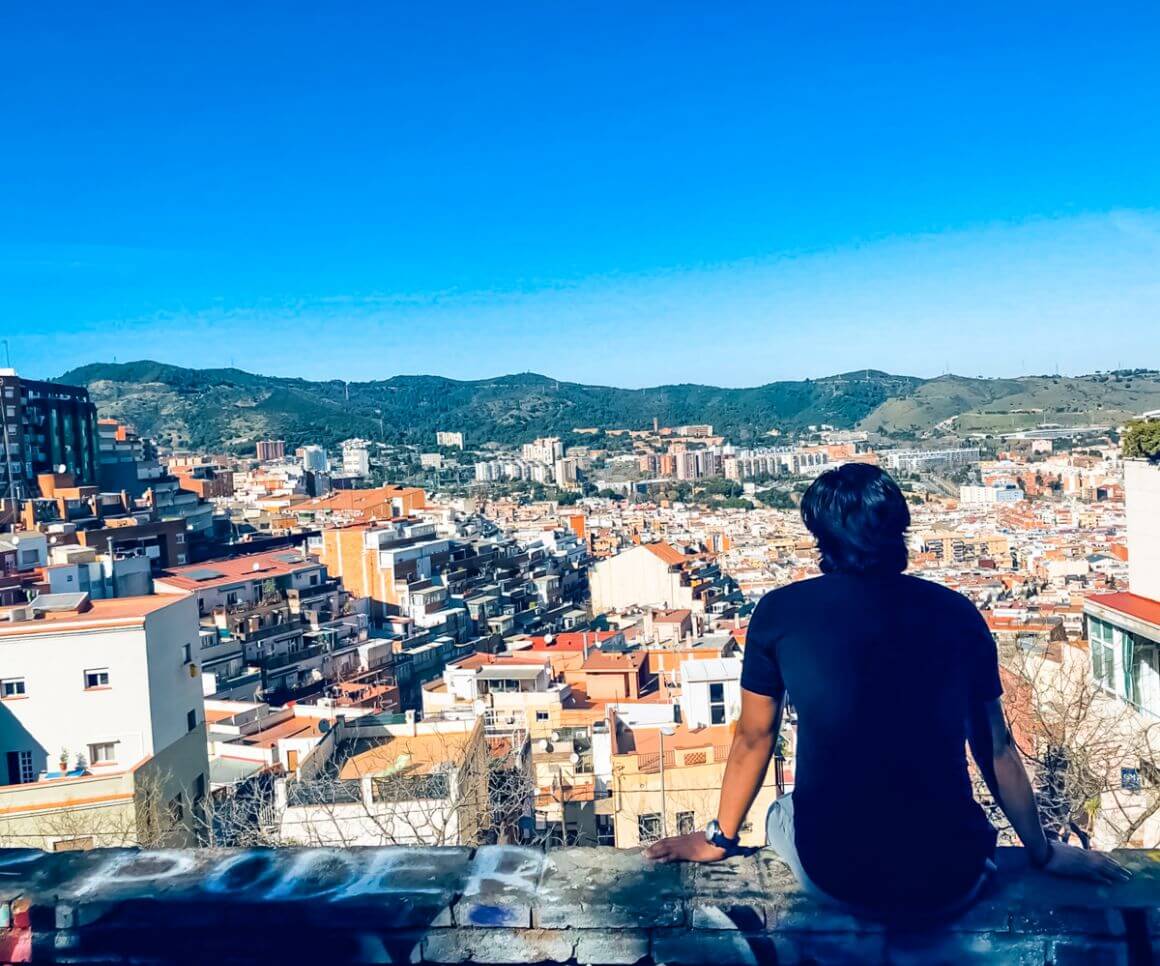 A person taking in views from Turó de la Rovira Hill, Barcelona