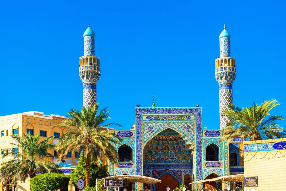 Stunning architecture with blue and beige patterns at the Iranian Mosque, Dubai 