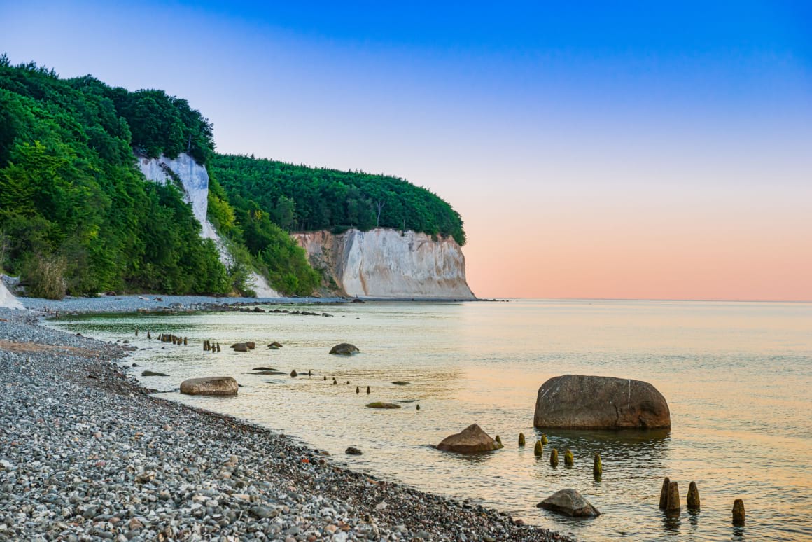 Rocky beach overlooking ocean  in Rugen Island at sunset.