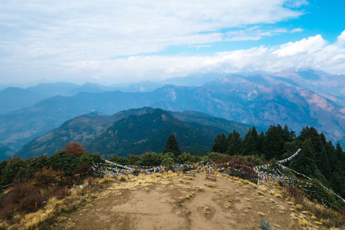 A landscape view of Poon Hill overlooking the Annapurna Massif mountain range and the Dhaulagiri mountains. 