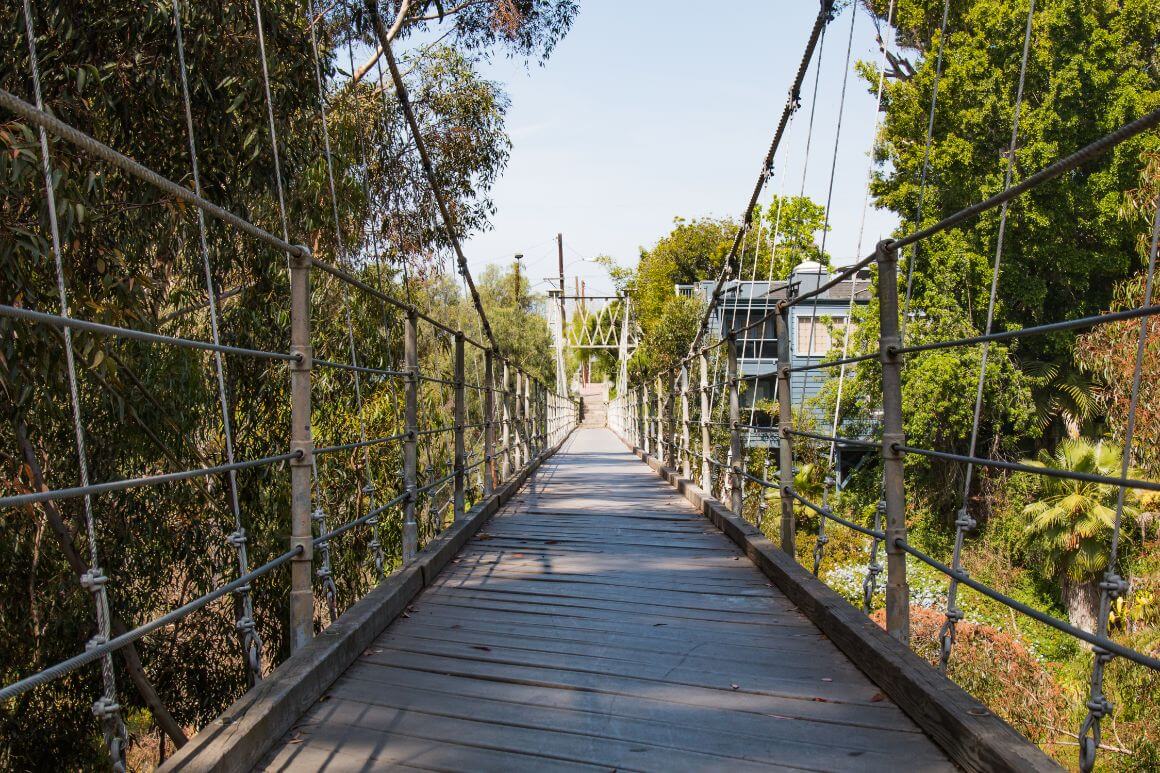 Spruce Street Suspension Bridge surrounded by lush greenery in San Diago