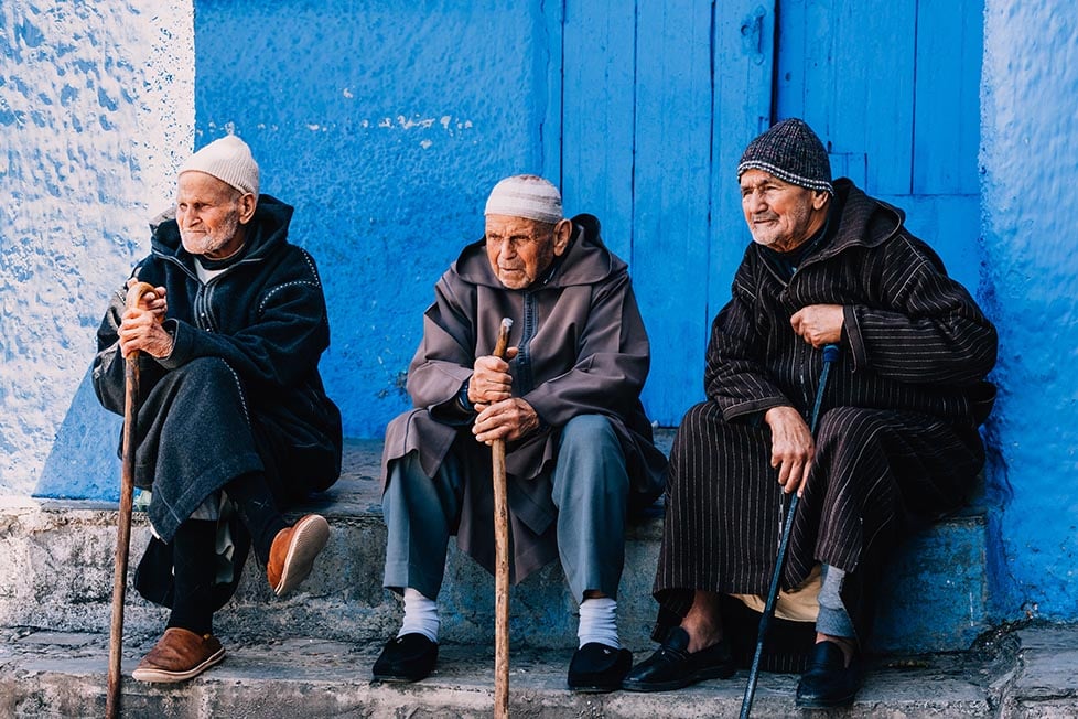 Three Moroccan men in traditional clothing