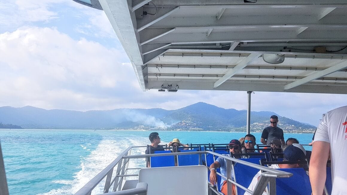 Rear view of a boat with views of mountains in the background