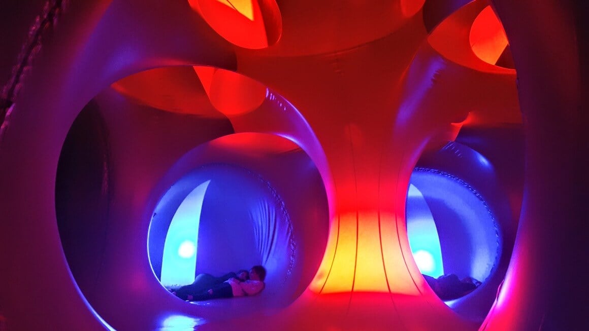 People relaxing and walking around the Liminerium at Sziget Festival 