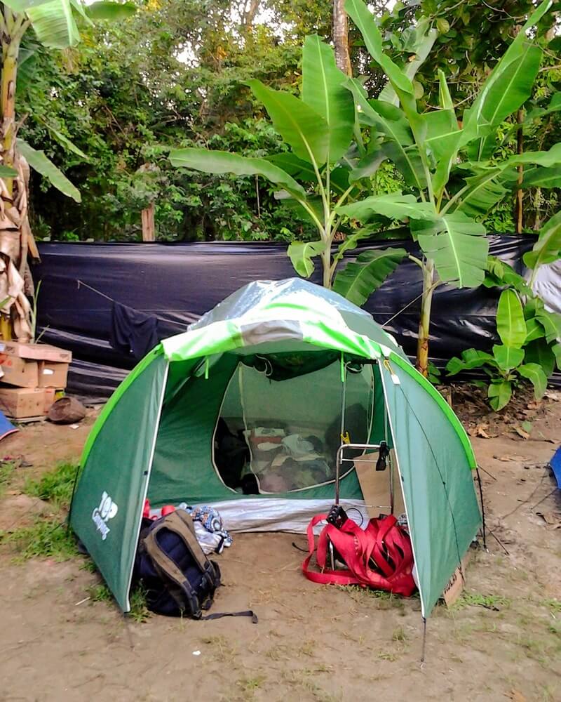 Camping tent set in Brazil in nature with trees around.