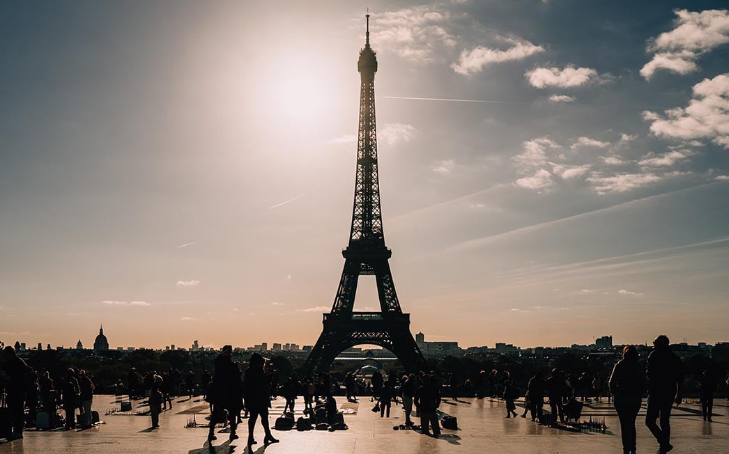 The Eiffel Tower with the sun behind it