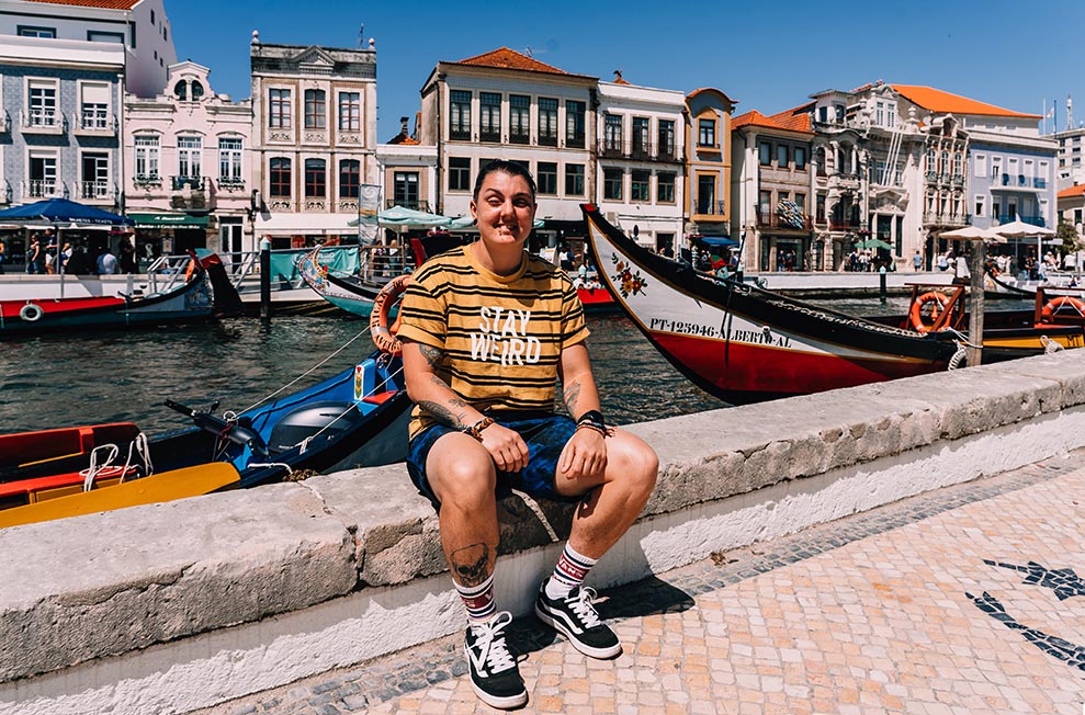 A person sat by the canal in Aveiro, Portugal