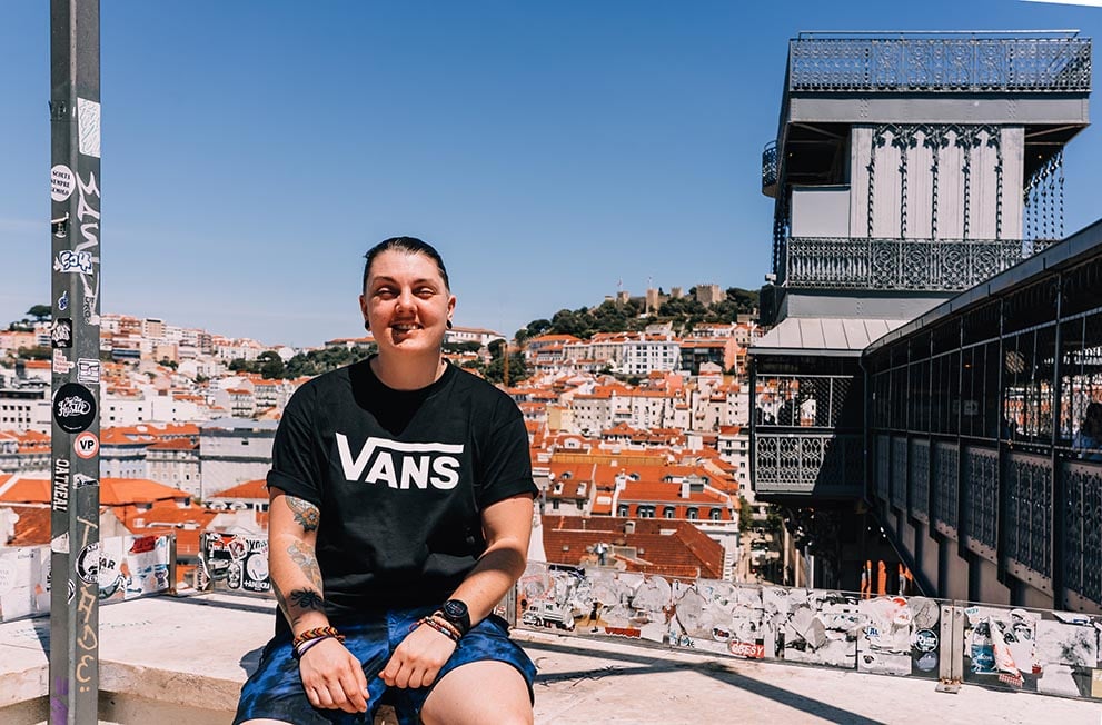 A person sat by the Santa Justa Elevator in Lisbon, Portugal