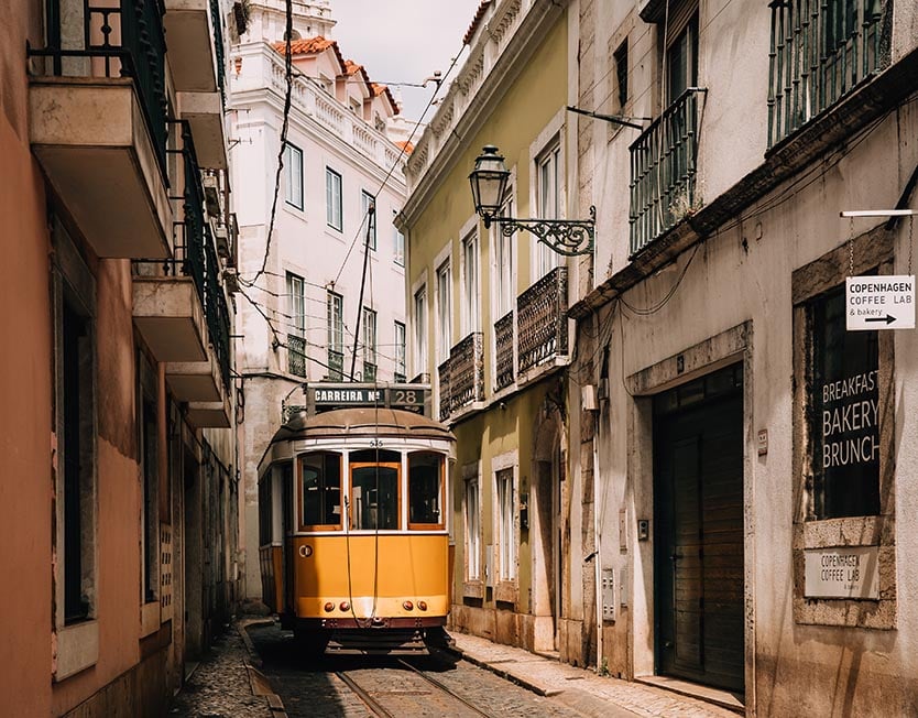 A tram coming down a street in Lisbon, Portugal