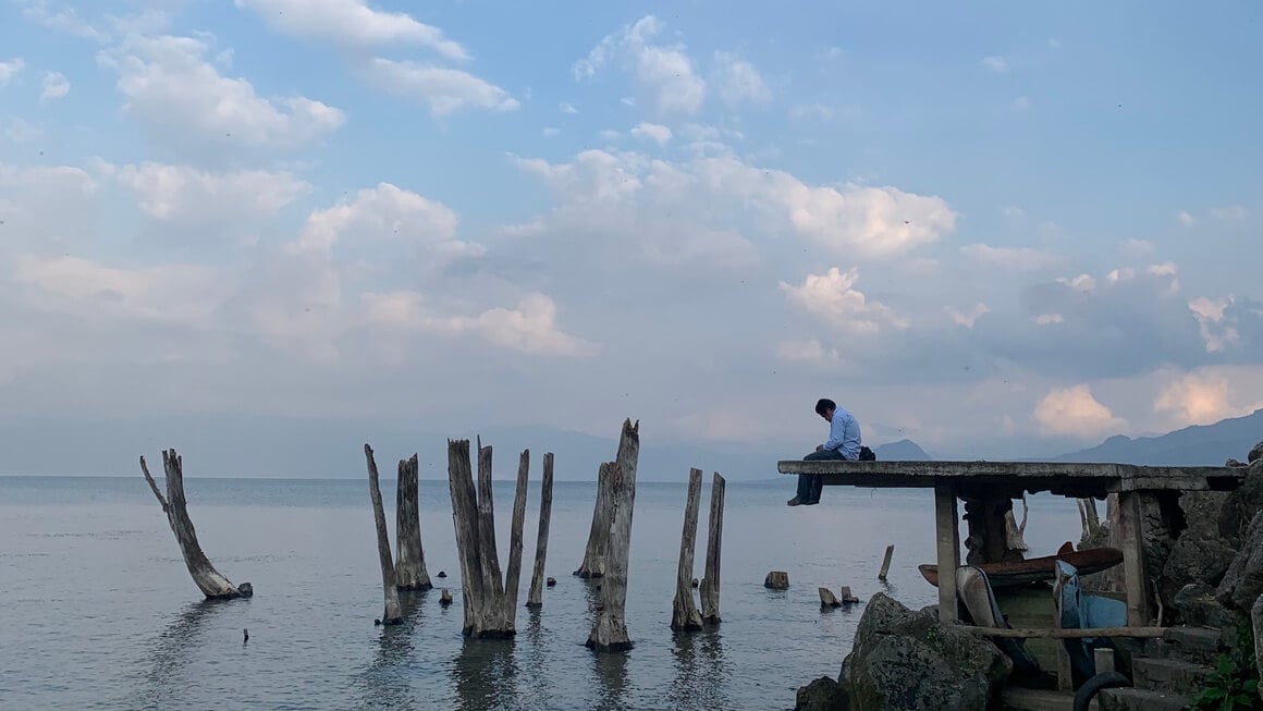 man on deck at Lake Atitlan, guatemala