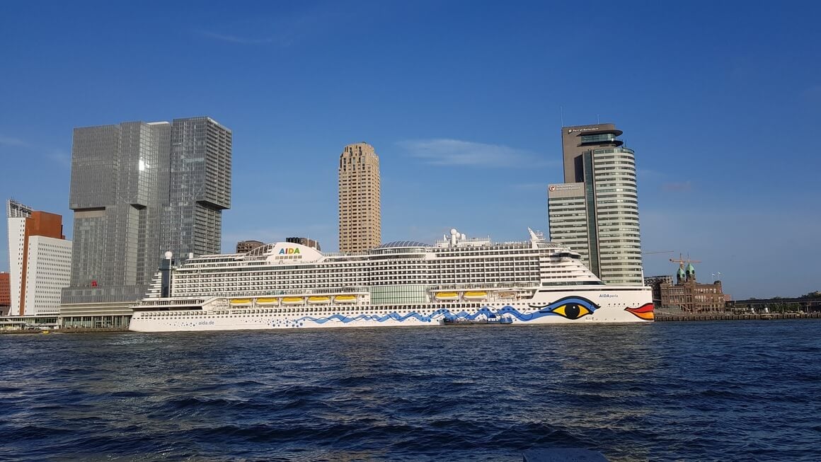 Large cruise ship blending into to the skyline at Rotterdam port.