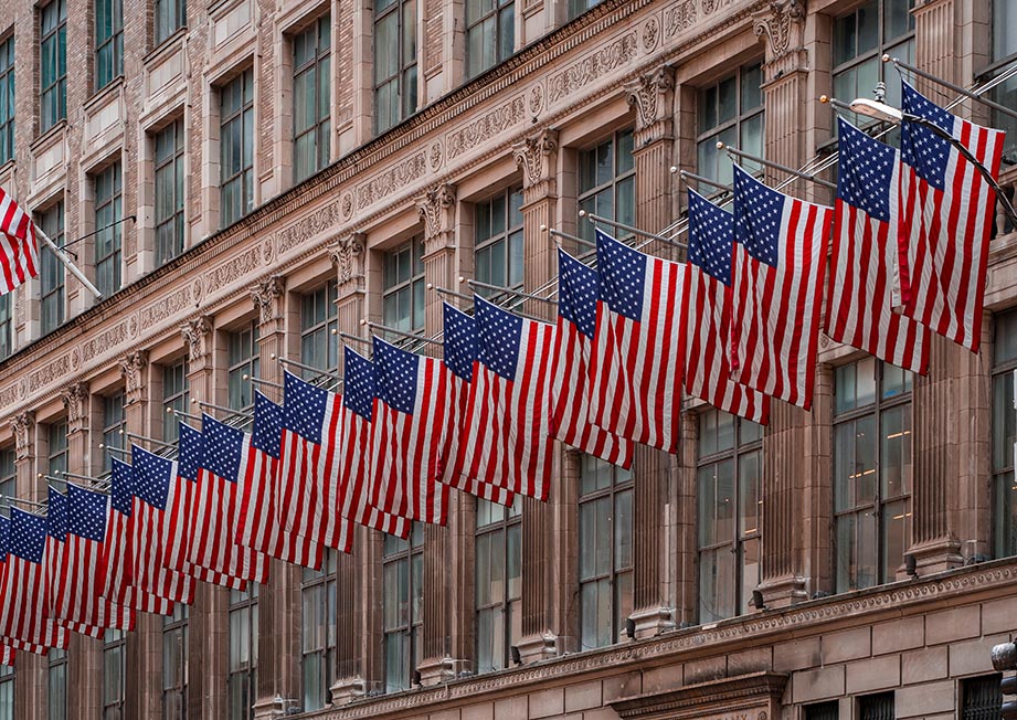A row of American flags on a building on 5th Ave, NYC United States of America.