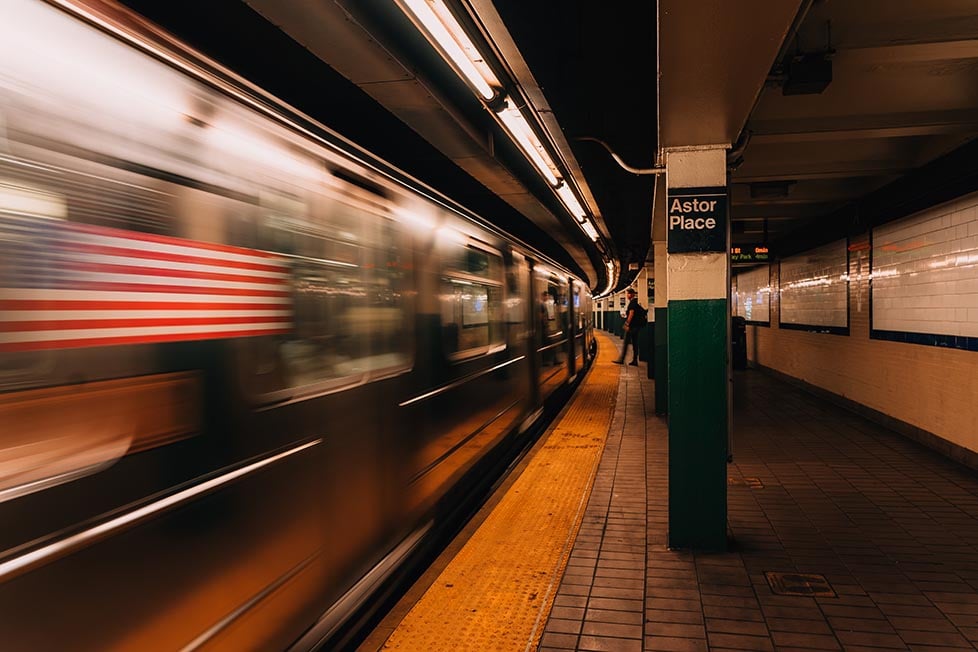 A speeding train in an NYC subway station